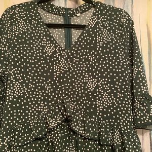 Green dress with white polka dots.